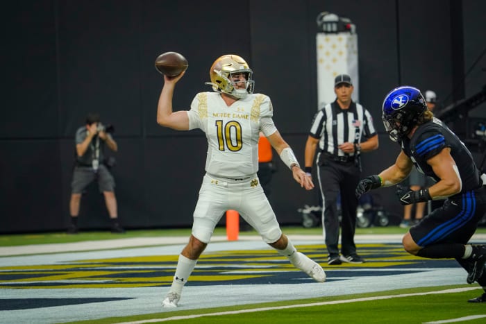 Notre Dame Fighting Irish quarterback Drew Pyne (10) throws a pass against the Brigham Young Cougars during the first half at Allegiant Stadium.